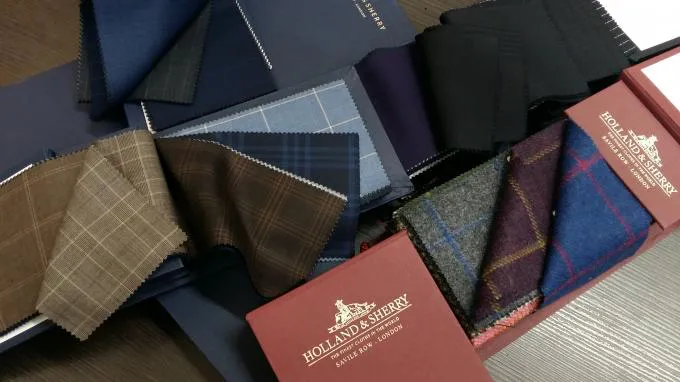 Holland & Sherry Savile Row swatch books and rare-fiber suiting cloth — bespoke at By Fino Los Gatos