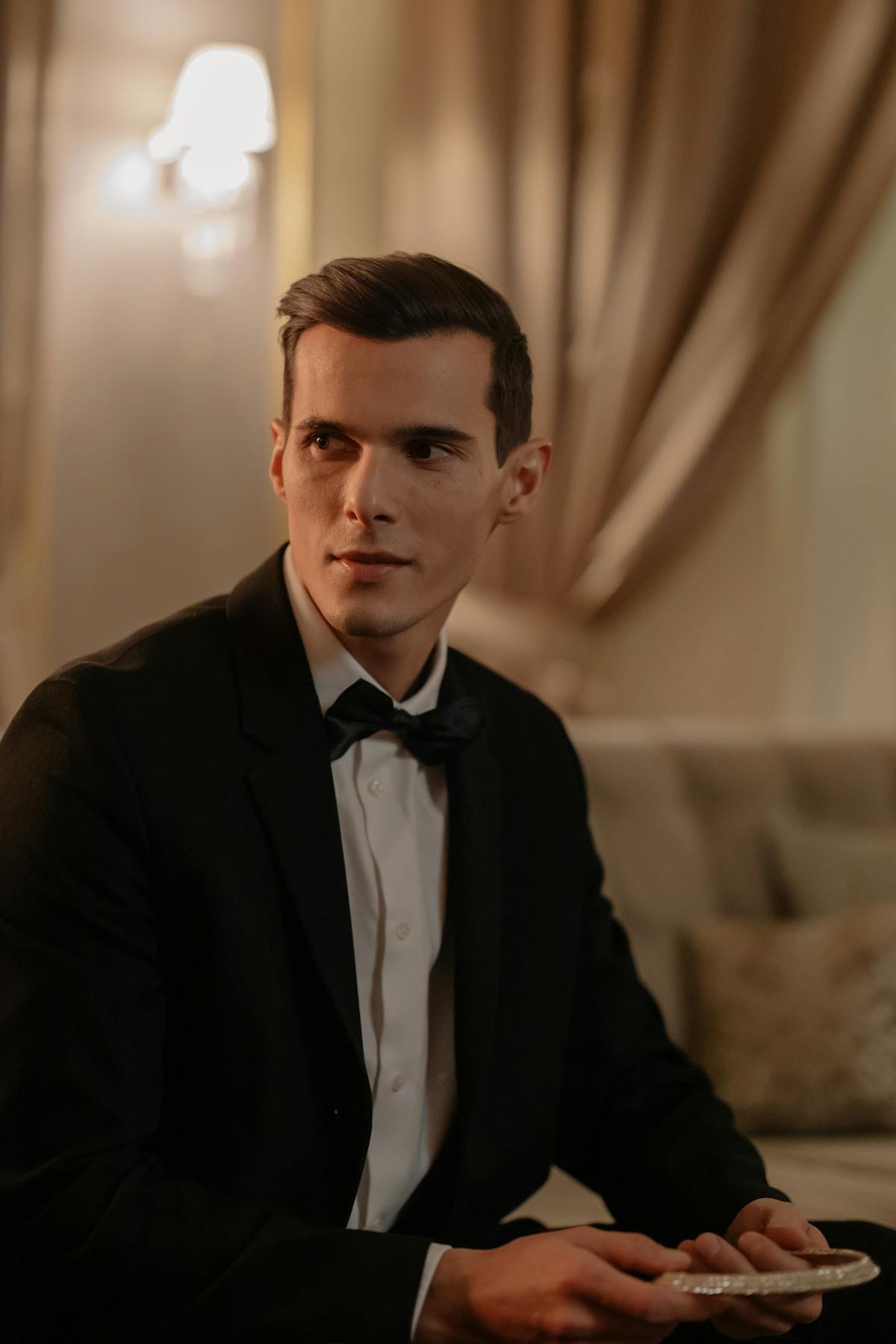 Man in custom black tuxedo at a formal gala event