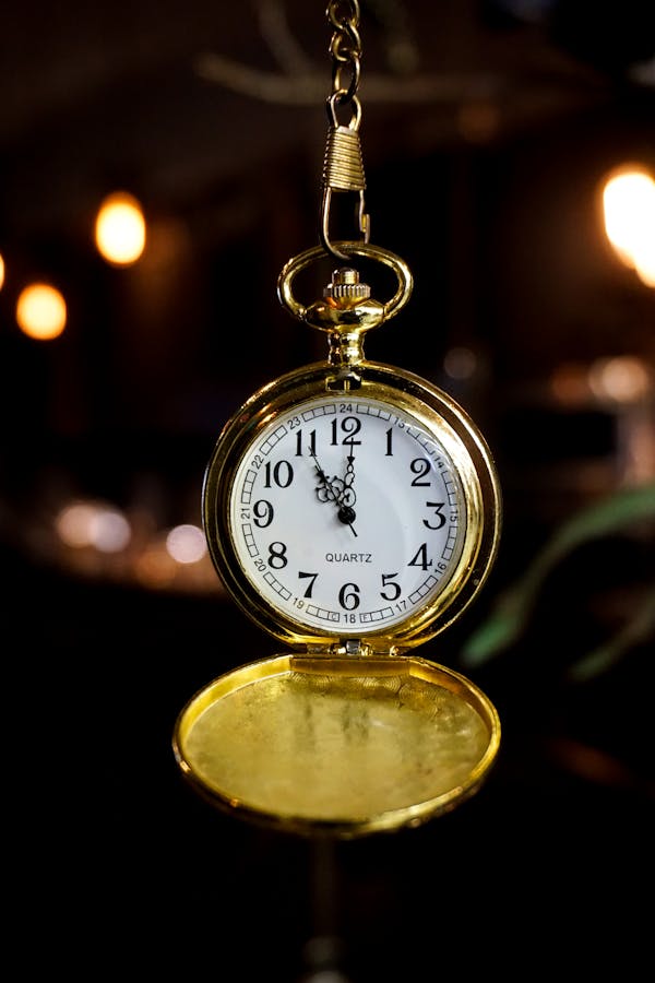 Gold pocket watch and wedding suit details