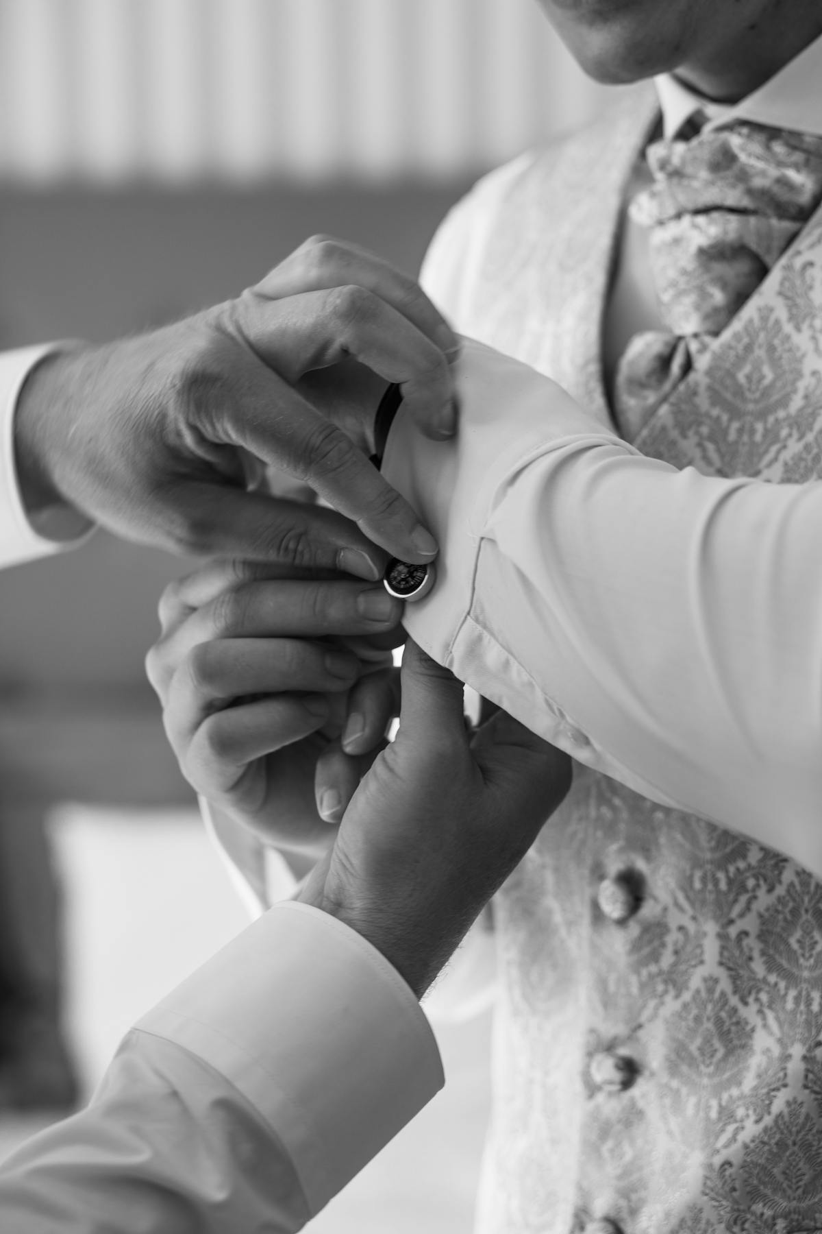 Groom preparing for his wedding in a bespoke Fino suit