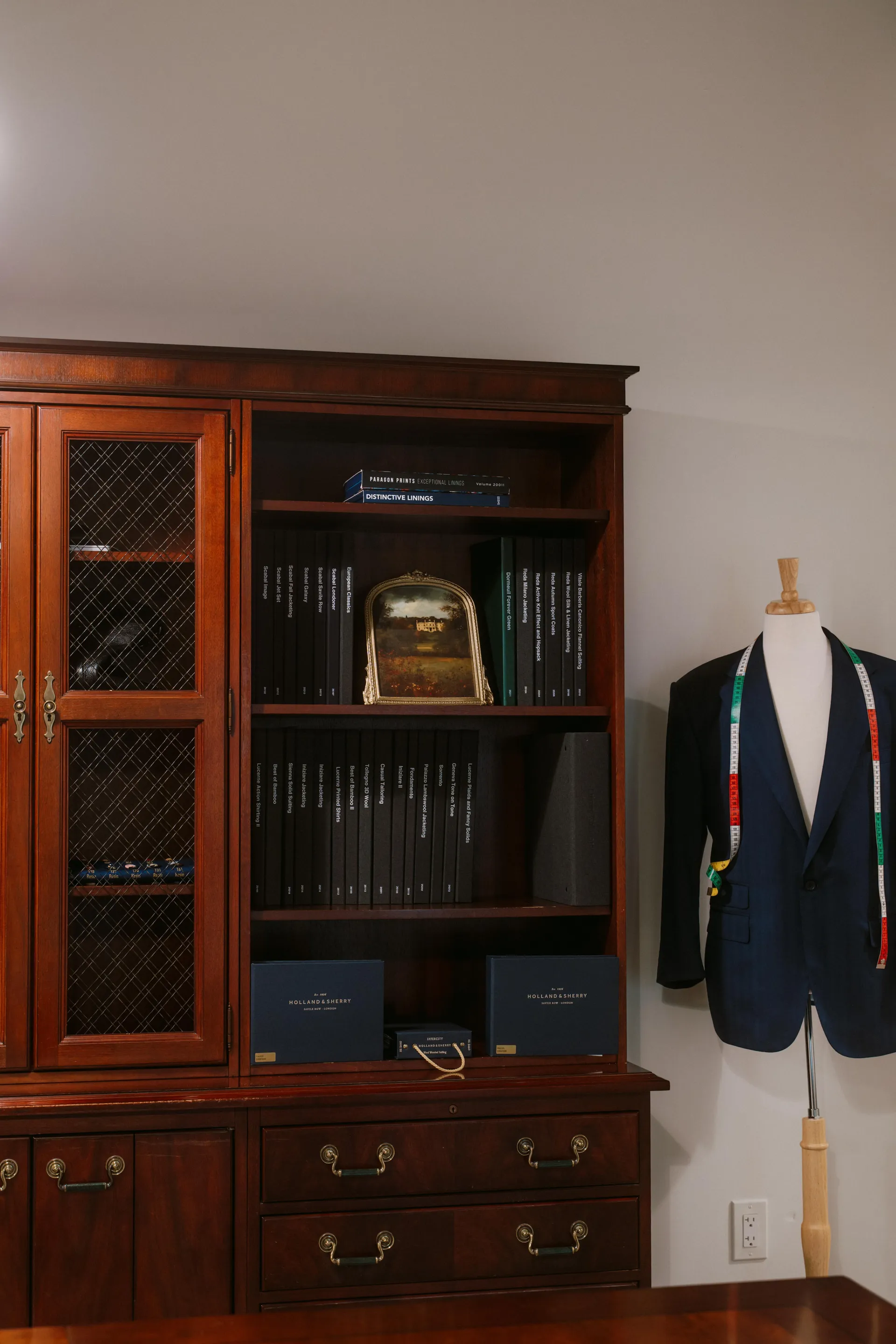 Fino fabric library — mahogany cabinet filled with premium fabric swatch books